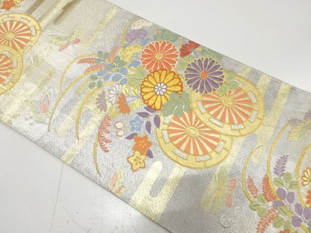 Bag belt with butterfly pattern woven into a floral wheel