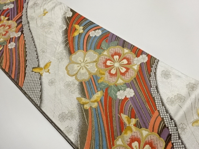 曲線に桜・蝶模様織出し袋帯