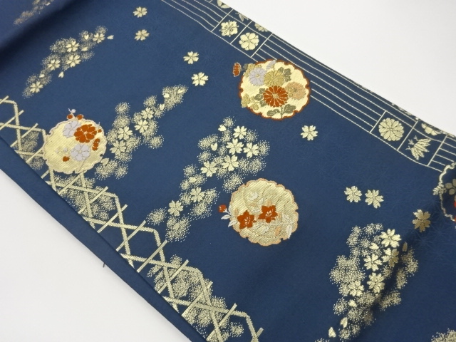 雪輪に草花模様織出し名古屋帯