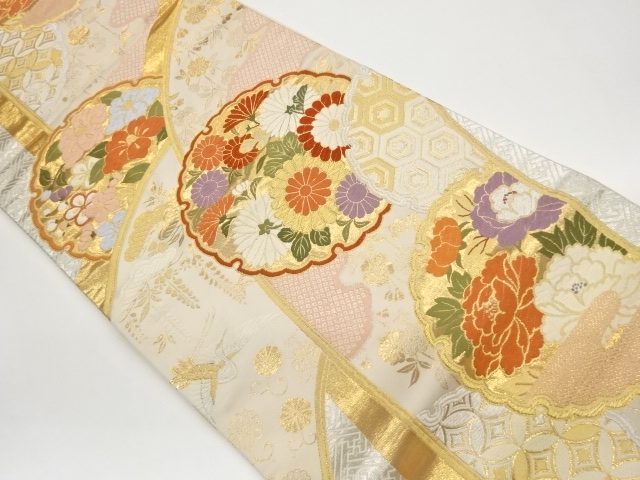 雪輪に花々・鶴・松藤模様織出し袋帯